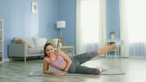Woman Lying on Side Lifting Leg on Exercise Mat