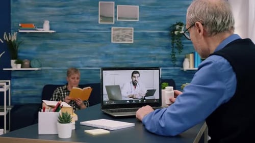 Senior Man Telehealth Consultation with Doctor at Home