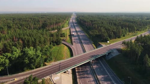 Highway and overpass with cars and trucks