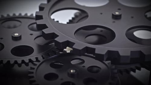 Black Gears Rotating Together