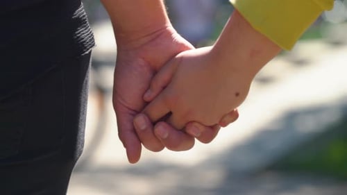 Couple holding hands