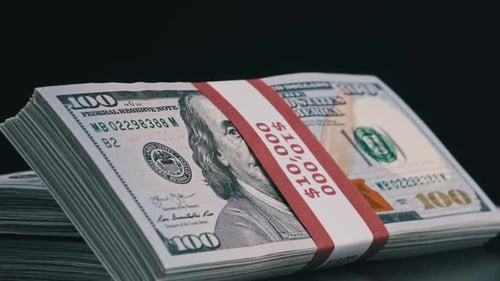 Zoom In on Stacked Bundles of Hundred Dollar Bills