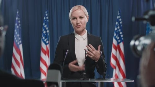 Woman Giving a Speech at a Press Conference