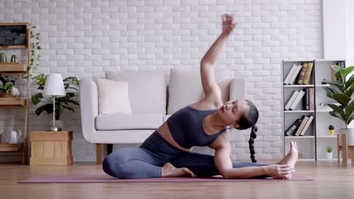 Asian woman pilates exercise yoga at home.