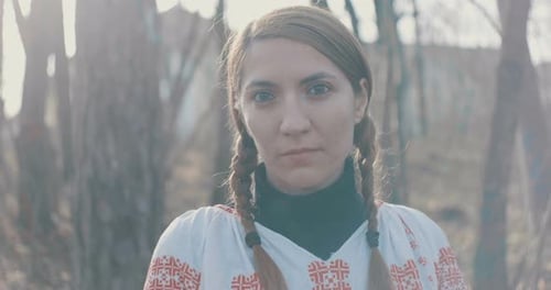 Woman with Braids in Forest Portrait