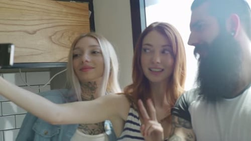 Friends Taking a Selfie Together Indoors
