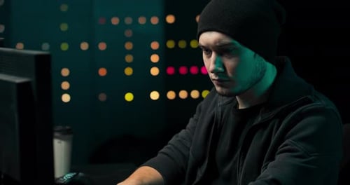 Young Adult Working on Computer at Night