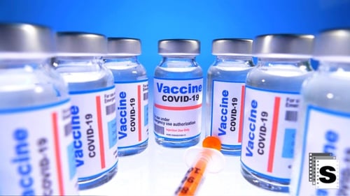COVID-19 Vaccine Vials with Syringe on Blue Background