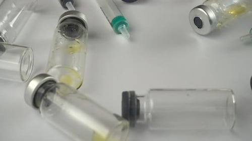 Medical Vials and Syringes on White Surface