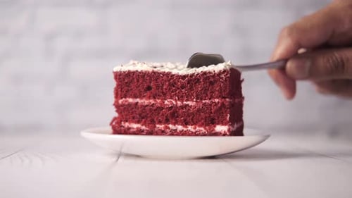 Red Velvet Cake Slice Being Taken by Spoon