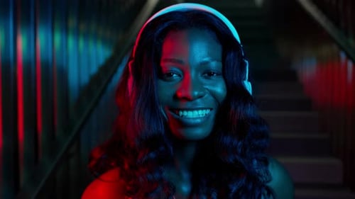 Young Woman With Headphones Smiling Close Up