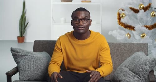 View From Web Camera Black Man Afro American Businessman Student Wears Glasses and Yellow Sweater
