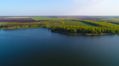 Flying Over the Beautiful Spring River. Aerial Camera Shot. Ukraine