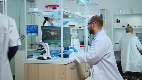 Scientists Working in a Modern Medical Research Laboratory