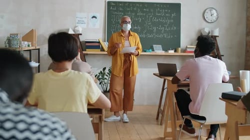 Teacher Explaining Math to a Classroom of Students