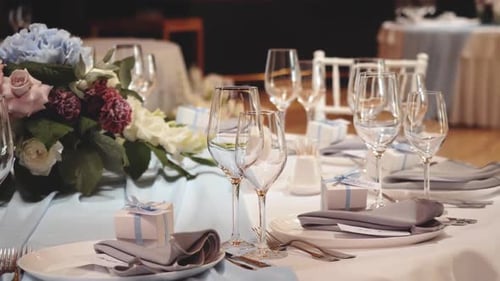 Wedding Table Setting with Flowers and Gifts