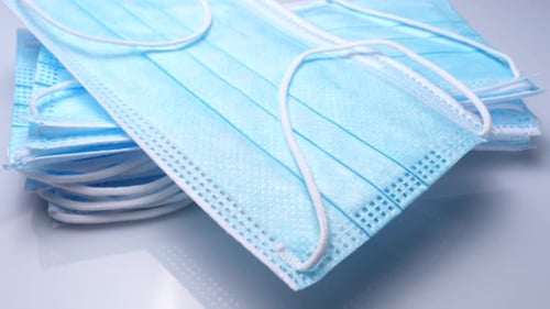 Pile of Clean Surgical Masks for Medical Use