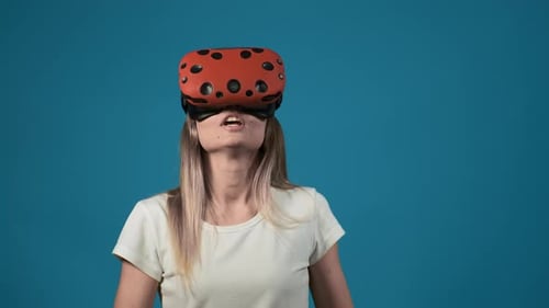Lady with Orange Virtual Reality Headset Screams at Wall