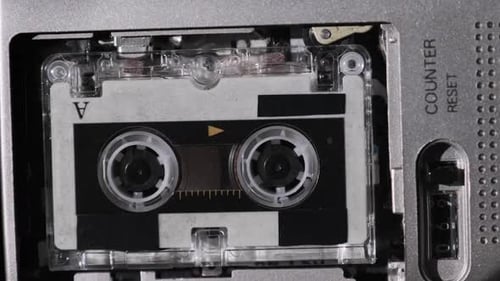 The Microcassette Spins in a Portable Handheld Recorder Tape Retro Player