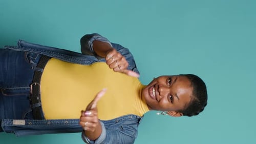 Smiling Woman Gives Thumbs Up Gesture