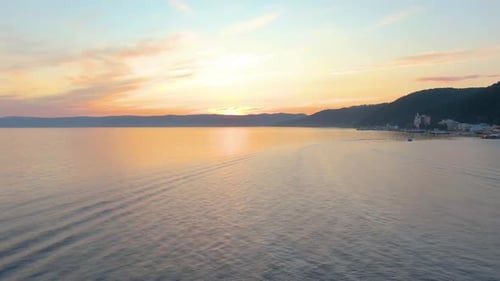 Aerial Footage of Flight Over the Sea at Sunset