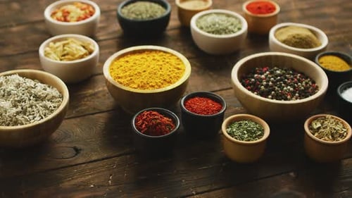 Assorted Spices and Herbs on Wooden Table