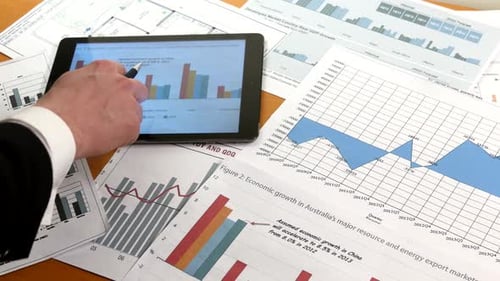 Business People Developing a Business Project and Analyzing Market Data Information