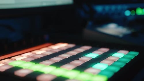 Hand presses beat pad to make music