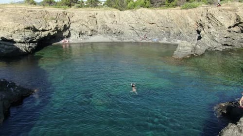 Swimming in an Unspoiled Mediterranean Seaside Beach