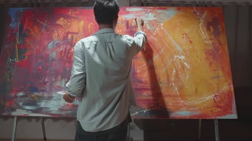 Young Artist Painting in a Studio