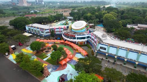 Aerial view of tropical resort with adventure waterpark and swimming pool area