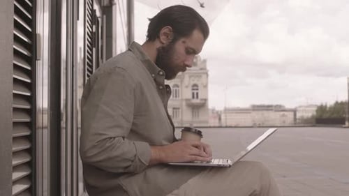 Freelancer Working on Laptop Outdoors