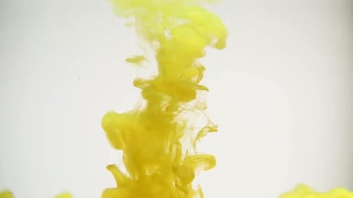 Yellow Ink Swirling Slowly in Water