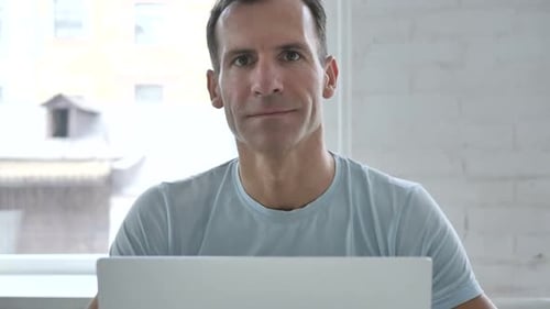 Smiling Man Looking at Camera