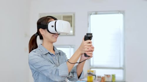 Woman Playing VR Game in Brightly Lit Room