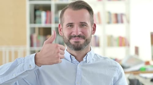 Smiling Man Gives Thumbs Up Gesture