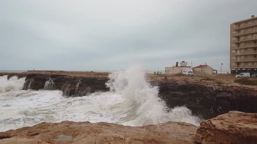Slow-motion Footage of Waves Violently Crashing Against Rocks
