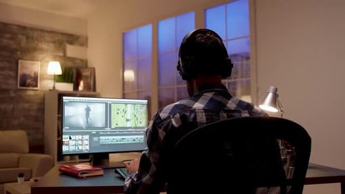 Back View of Young Content Creator Working on a Movie Project