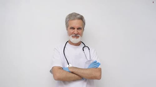 Mature Doctor Standing Confidently with Arms Crossed