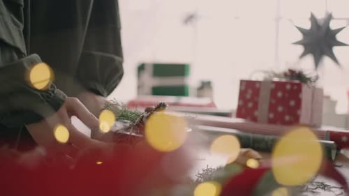 Festive Gift Wrapping at Wooden Table