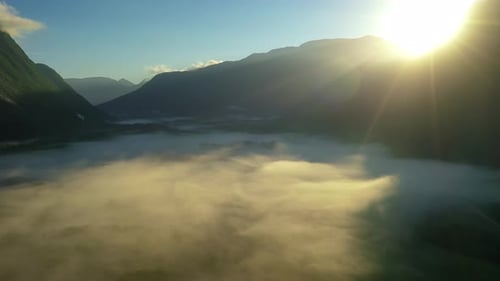 Morning Mist Over the Valley Among the Mountains in the Sunlight