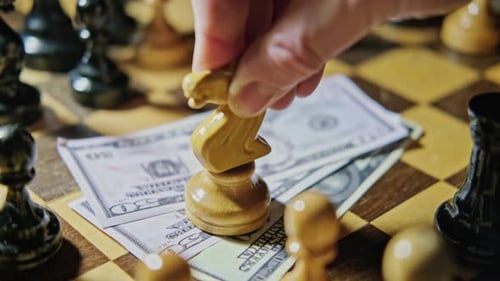 Chess Piece Placed on Stack of Money