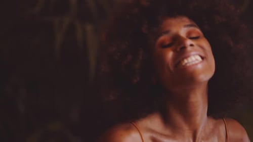 Young Beautiful Woman With Afro Posing And Smiling To Camera