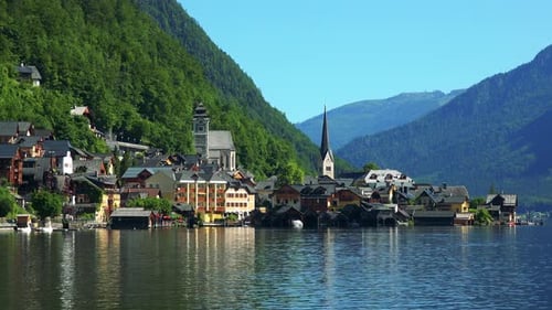 Village Hallstatt with Church Tower in Summer Day with Mountains