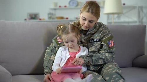 Woman in US Army Uniform with Young Daughter