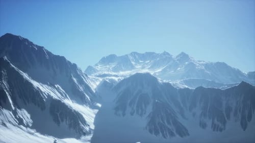 Aerial View Over Majestic Snowy Mountain Peaks