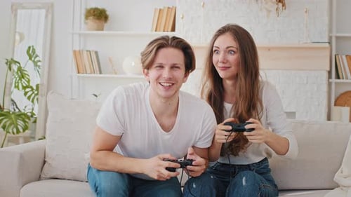 Couple Enjoying Video Games Together at Home
