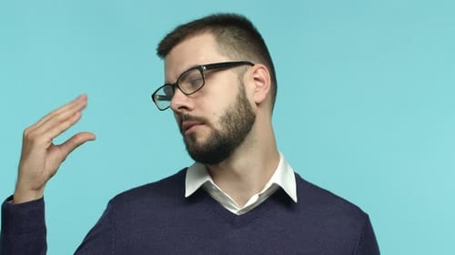 Bearded Man Gesturing and Talking on Blue Background