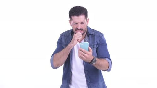 Frustrated Man Using a Smartphone