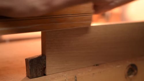 Close Up of Carpenter Planing Wood